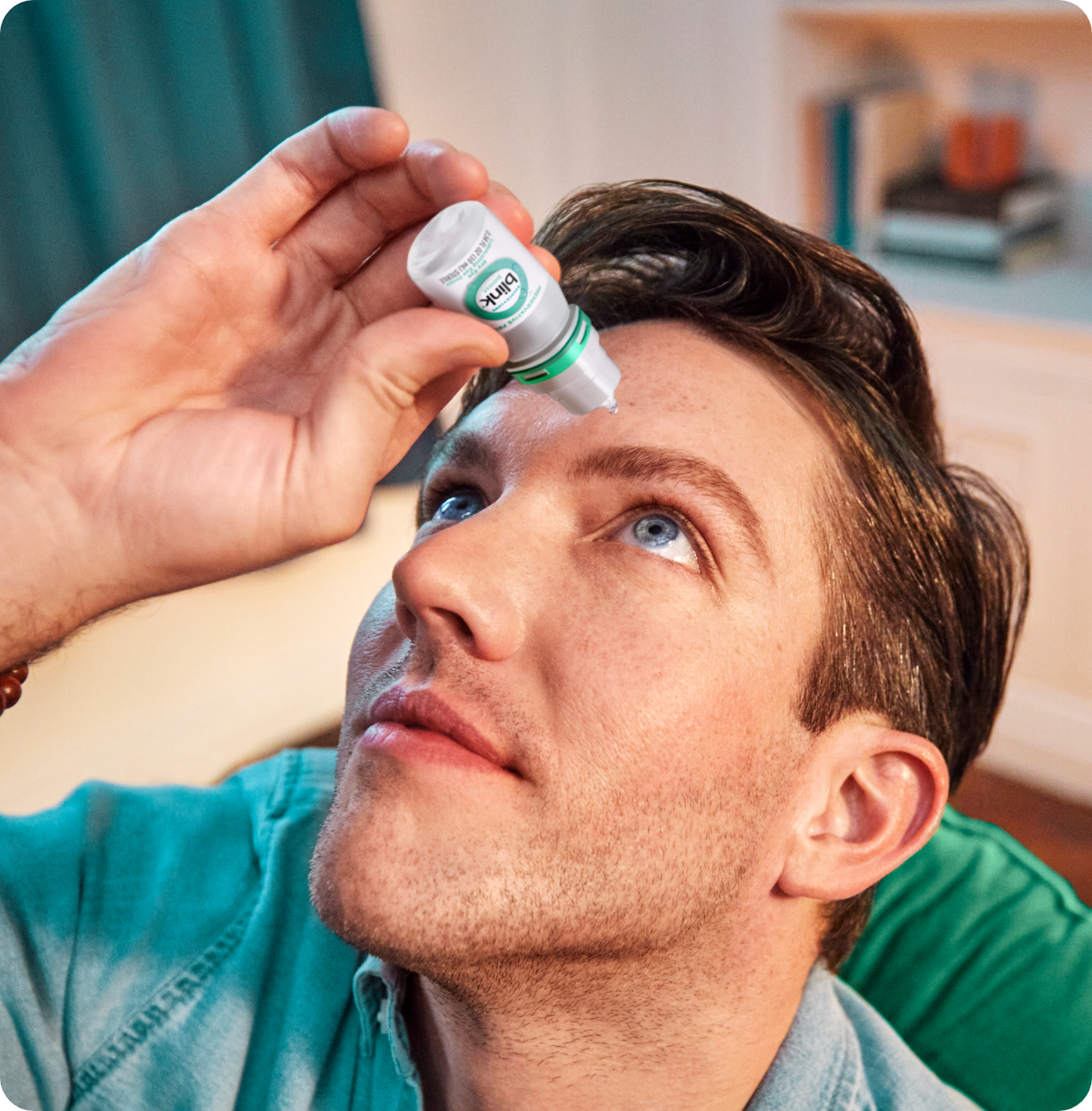 Man putting a drop of Blink Boost in his eye